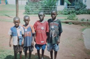 Denis (in red) and three of his brothers when they first came to Maria's Care in the mid 1990s